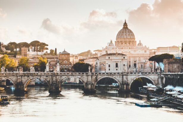 Panoramic view of Rome, Italy, showcasing historic architecture along the river, bathed in warm sunlight for a group trip planned by My Tailored Escape luxury travel agency.