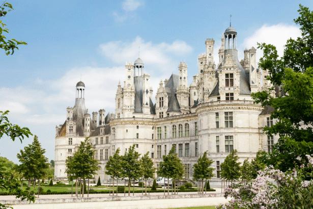 Majestic Château de Chambord, a stunning Renaissance castle in the Loire Valley, France, surrounded by lush gardens.